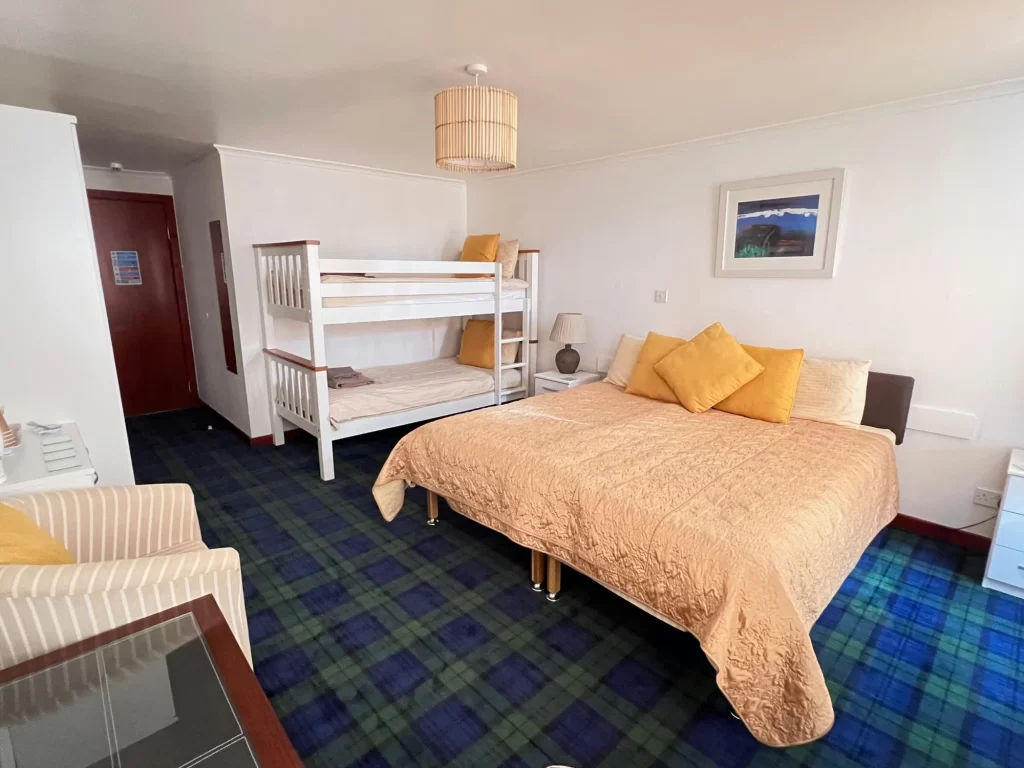 Spacious family room at The Old Inn Gairloch, featuring bunk beds and ample space for families on a Highland holiday.
