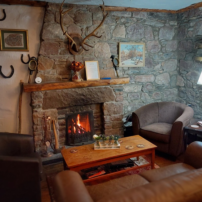 The fireplace at The Old Inn, where our guests relax after a day exploring the Highlands.
